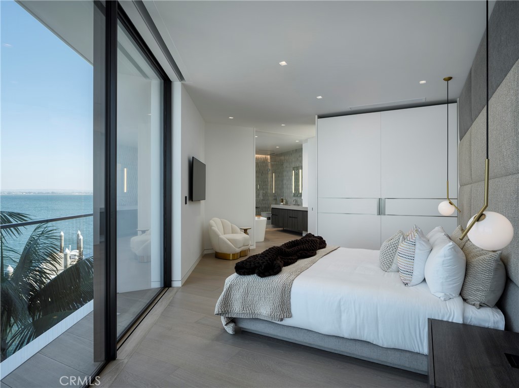 3 The Point Coronado, CA 92118 - Photo 32 of 53 a bedroom with a bed and a painting on the wall