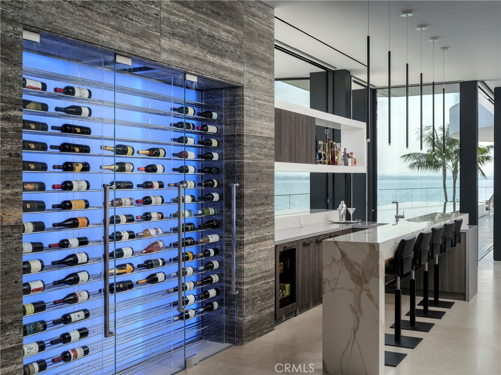 3 The Point Coronado, CA 92118 - Photo 41 of 53 a room with lots of wooden furniture and a window