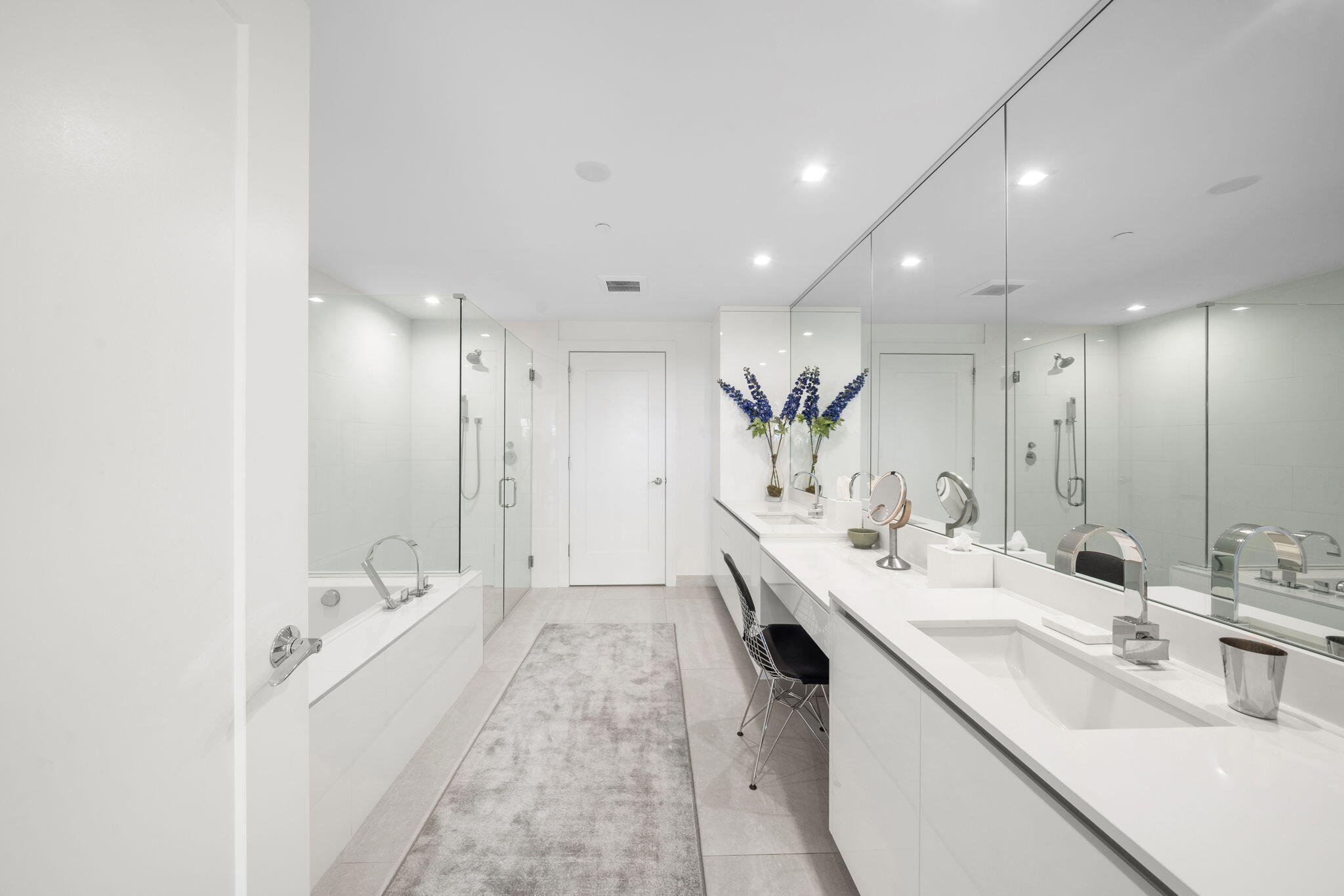 20155 Boca W Drive, Unit C201 Boca Raton, FL 33434 - Photo 13 of 42 a large white kitchen with a double vanity sink and mirror