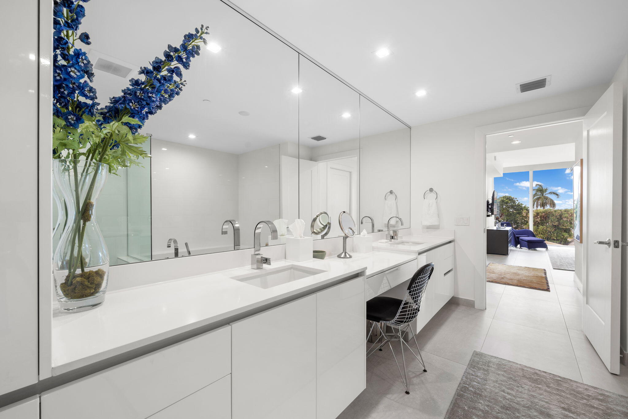 20155 Boca W Drive, Unit C201 Boca Raton, FL 33434 - Photo 14 of 42 a bathroom with a double vanity sink and a mirror