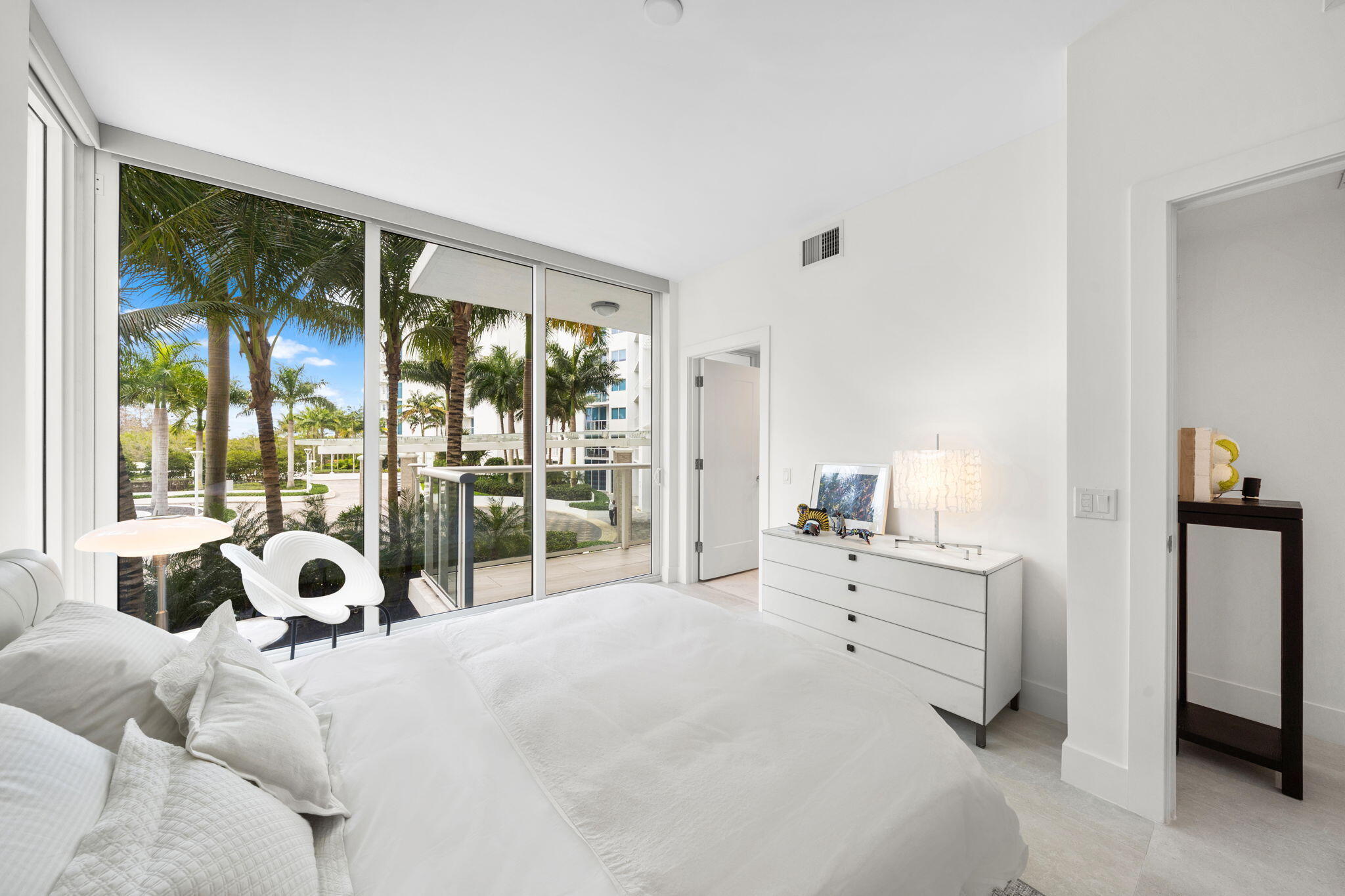 20155 Boca W Drive, Unit C201 Boca Raton, FL 33434 - Photo 18 of 42 a bedroom with a bed and large window
