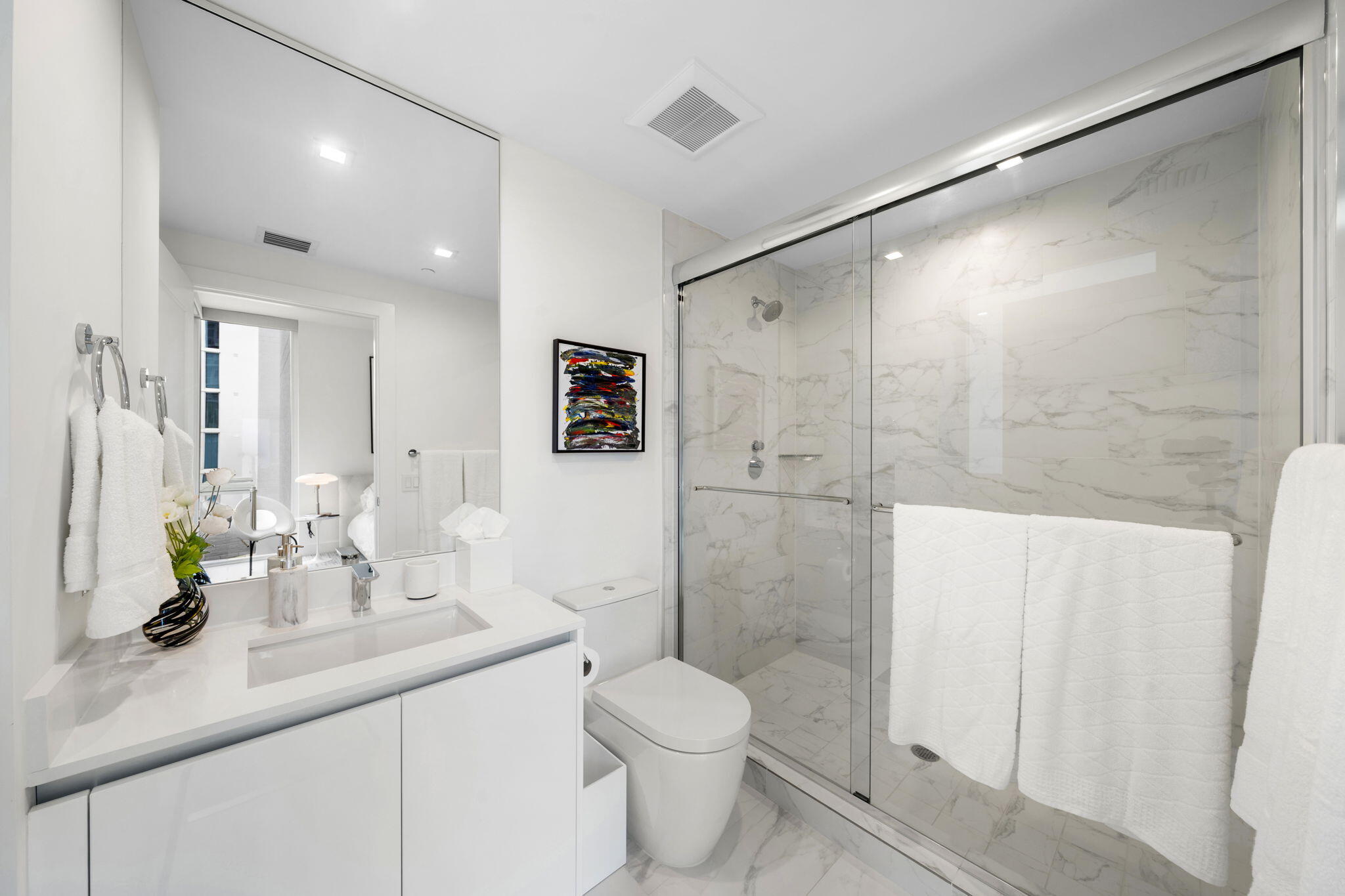 20155 Boca W Drive, Unit C201 Boca Raton, FL 33434 - Photo 20 of 42 a bathroom with a sink a toilet and shower