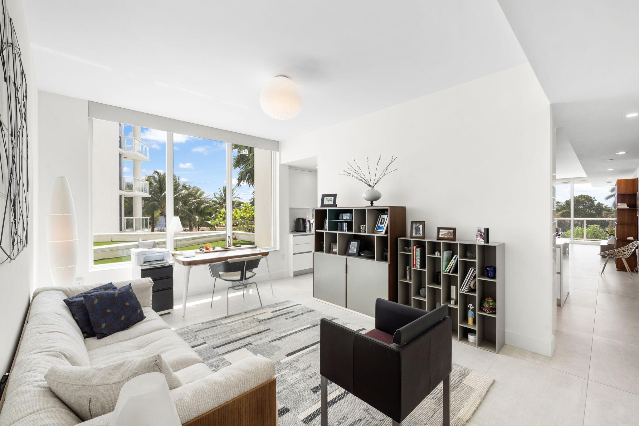 20155 Boca W Drive, Unit C201 Boca Raton, FL 33434 - Photo 22 of 42 a living room with furniture and a large window