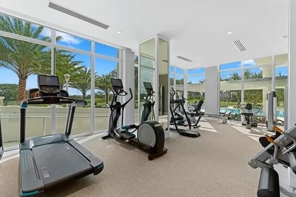 a room with lots of furniture and windows