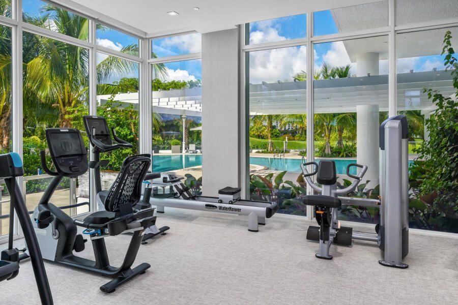20155 Boca W Drive, Unit C201 Boca Raton, FL 33434 - Photo 27 of 42 a room with lots of furniture and windows