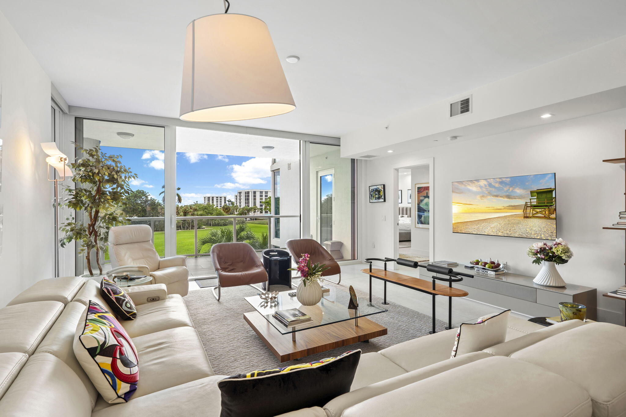 20155 Boca W Drive, Unit C201 Boca Raton, FL 33434 - Photo 3 of 42 a living room with furniture and a large window