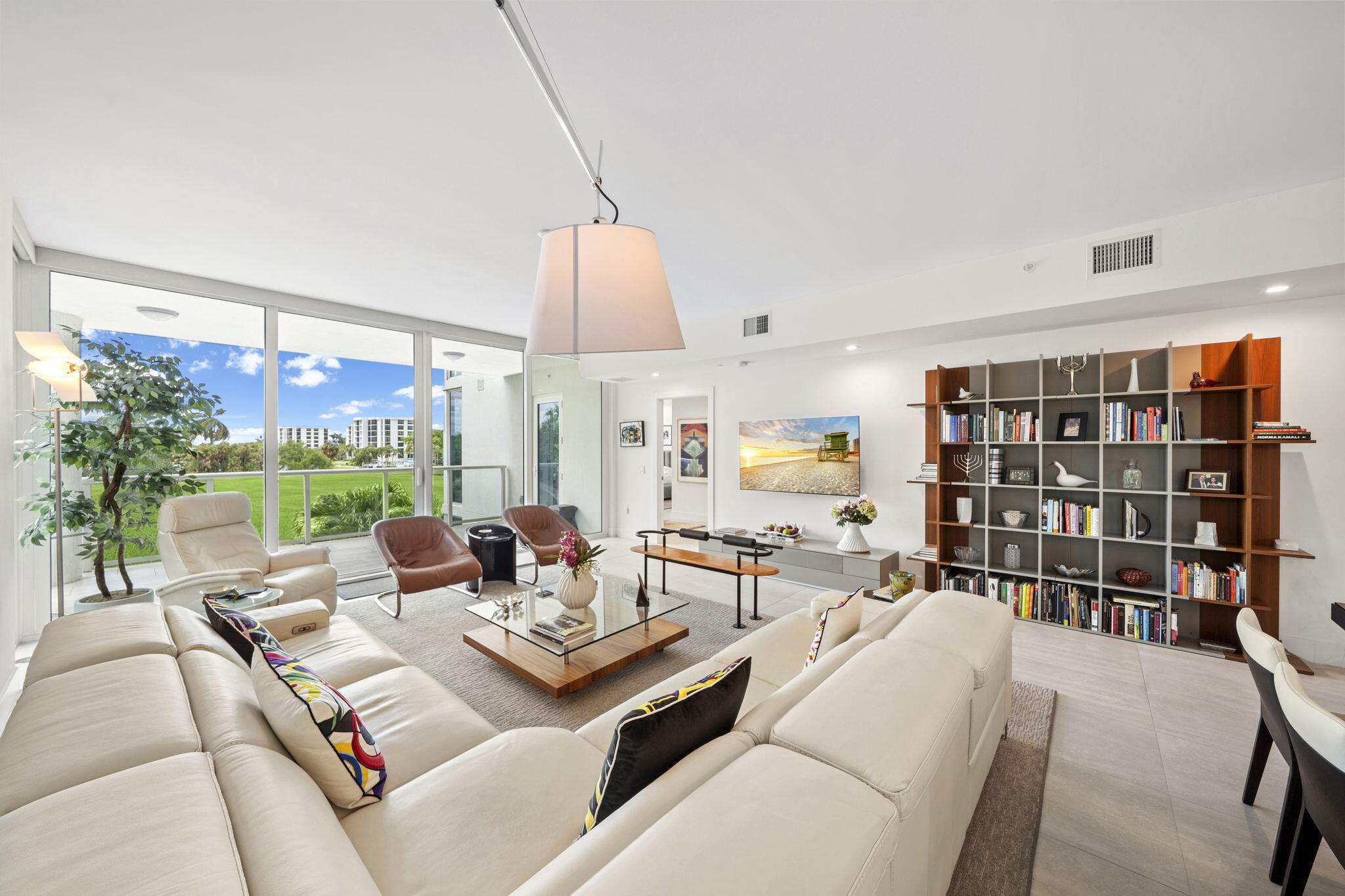 20155 Boca W Drive, Unit C201 Boca Raton, FL 33434 - Photo 4 of 42 a living room with furniture a rug and a large window