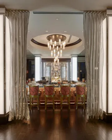 a view of a living room and chandelier