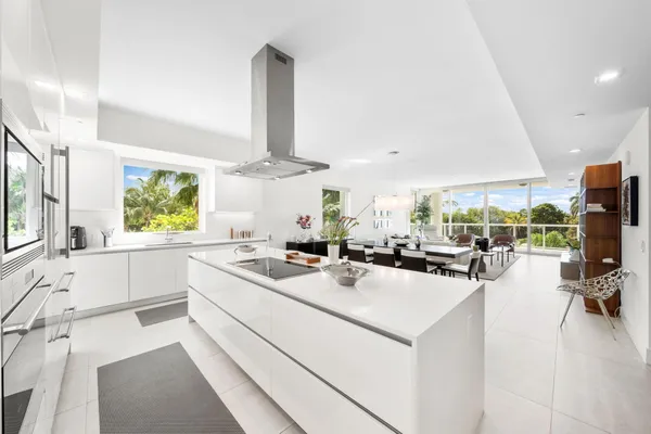 a kitchen with a stove a refrigerator and a sink