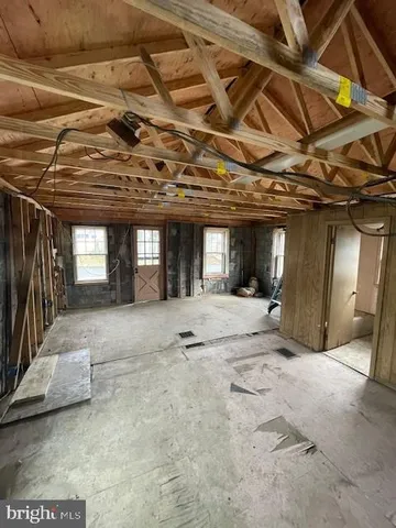a view of a hall with wooden floor