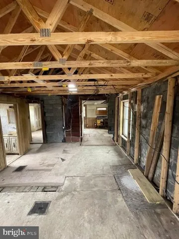 a view of a hall with wooden floor