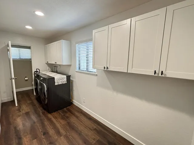 a view of kitchen with furniture and wooden floor