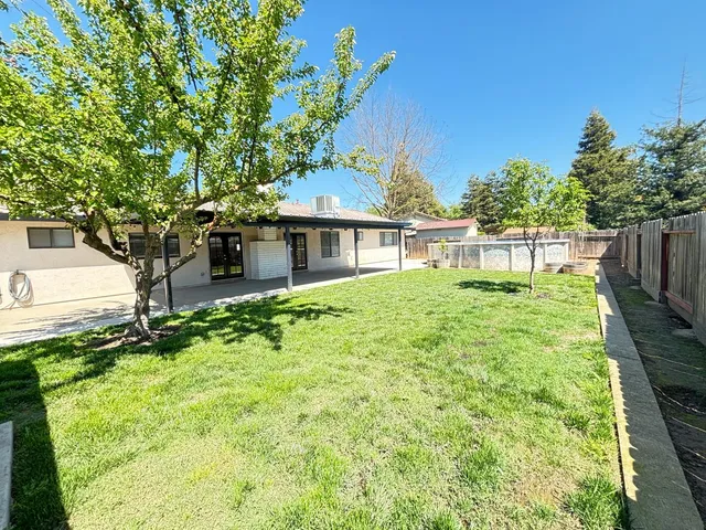 a house view with a garden space