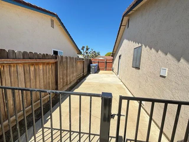 a view of balcony with furniture