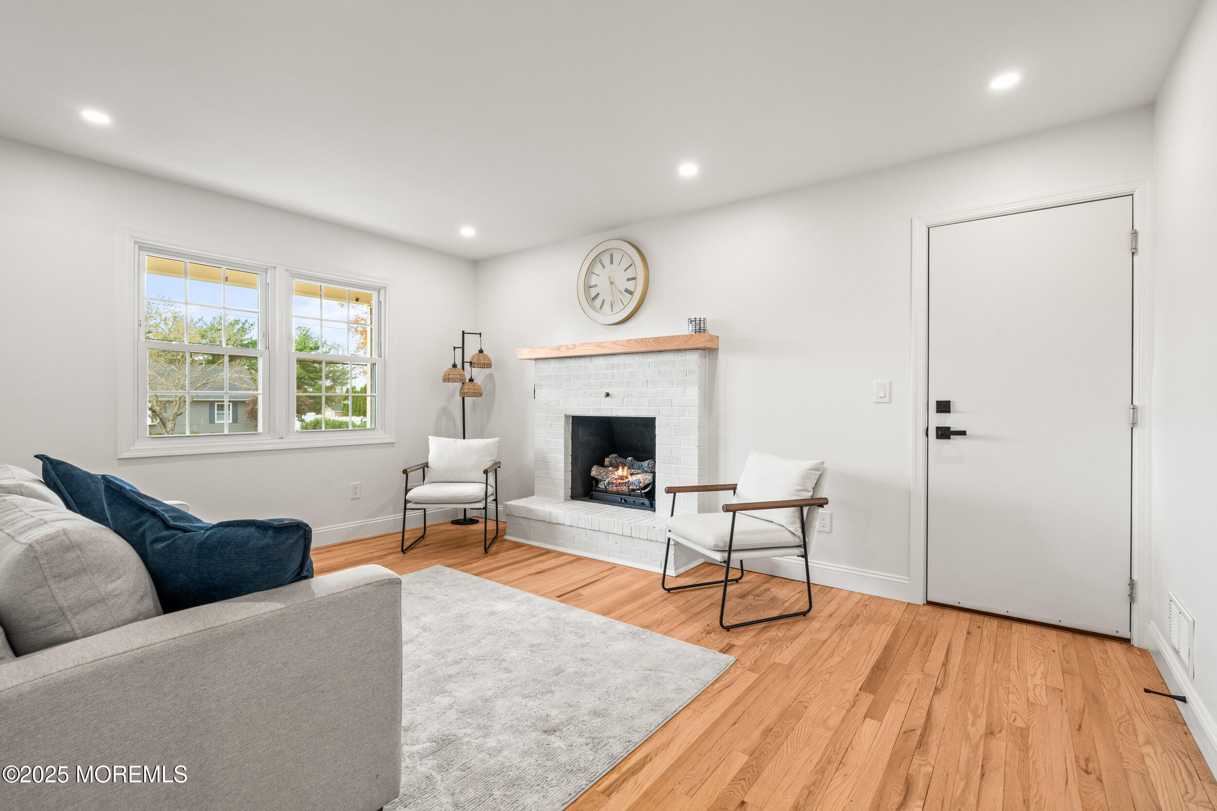 3412 Brandon Road Belmar, NJ 07719 - Photo 17 of 48 a living room with furniture a fireplace and a table