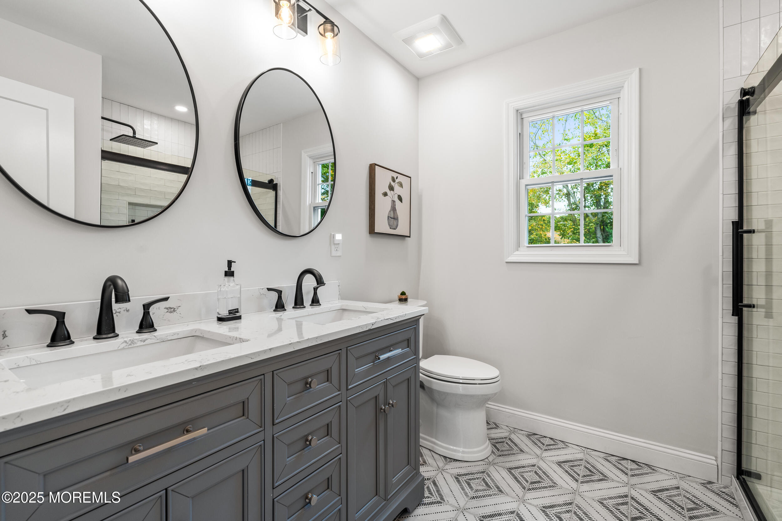 3412 Brandon Road Belmar, NJ 07719 - Photo 28 of 48 a bathroom with a granite countertop toilet a sink and a mirror