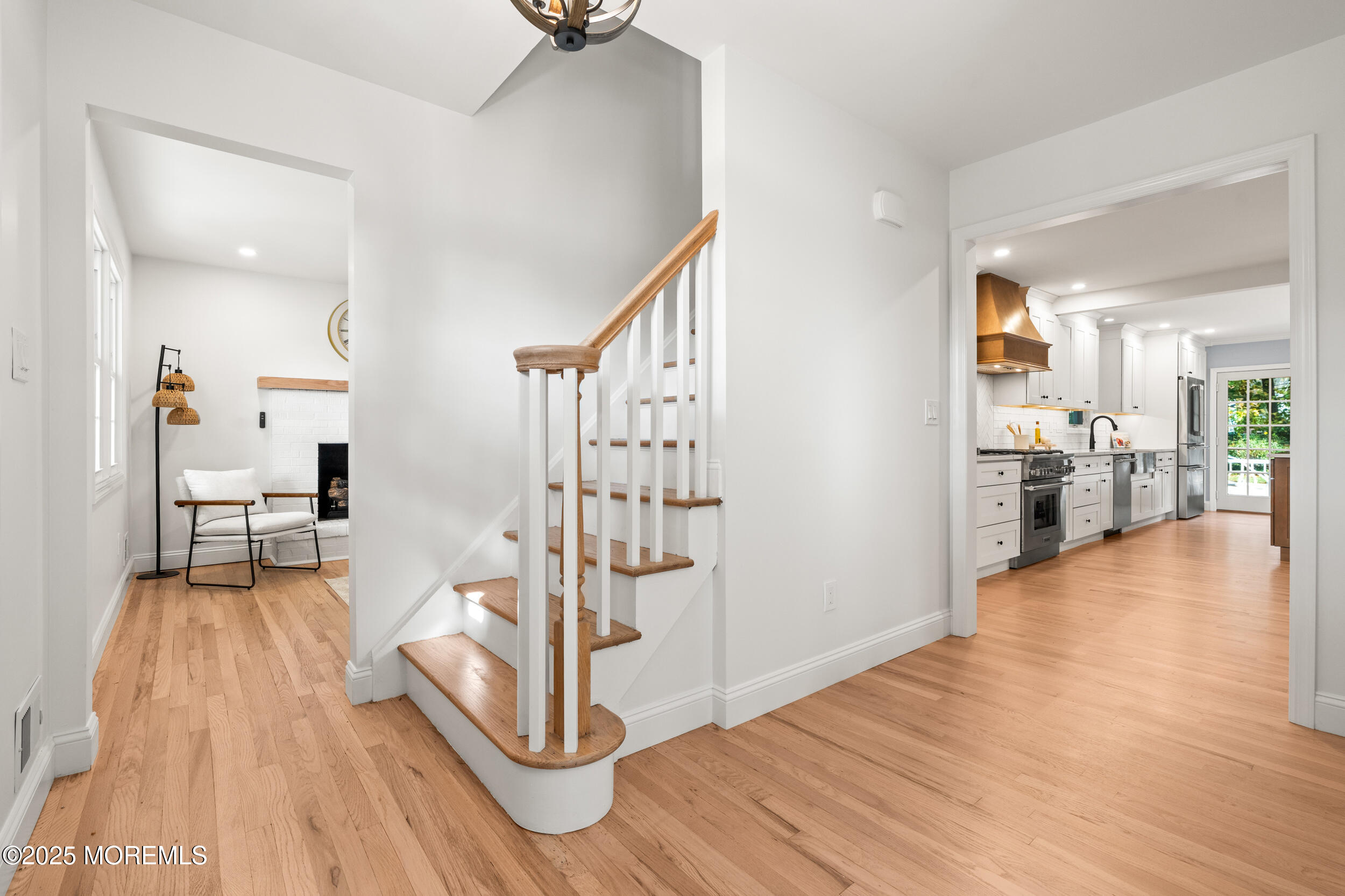 3412 Brandon Road Belmar, NJ 07719 - Photo 3 of 48 a view of a livingroom with wooden floor and a kitchen