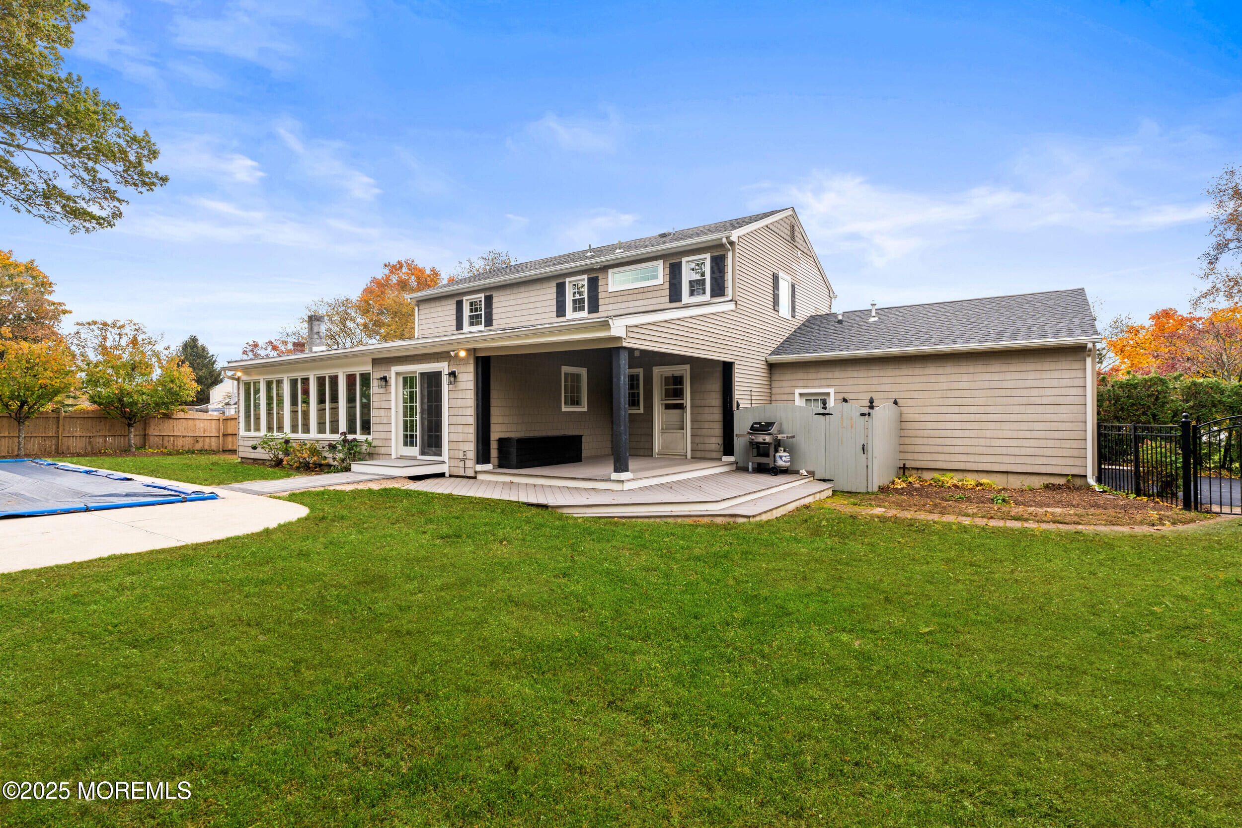 3412 Brandon Road Belmar, NJ 07719 - Photo 37 of 48 a view of a house with a patio and a yard