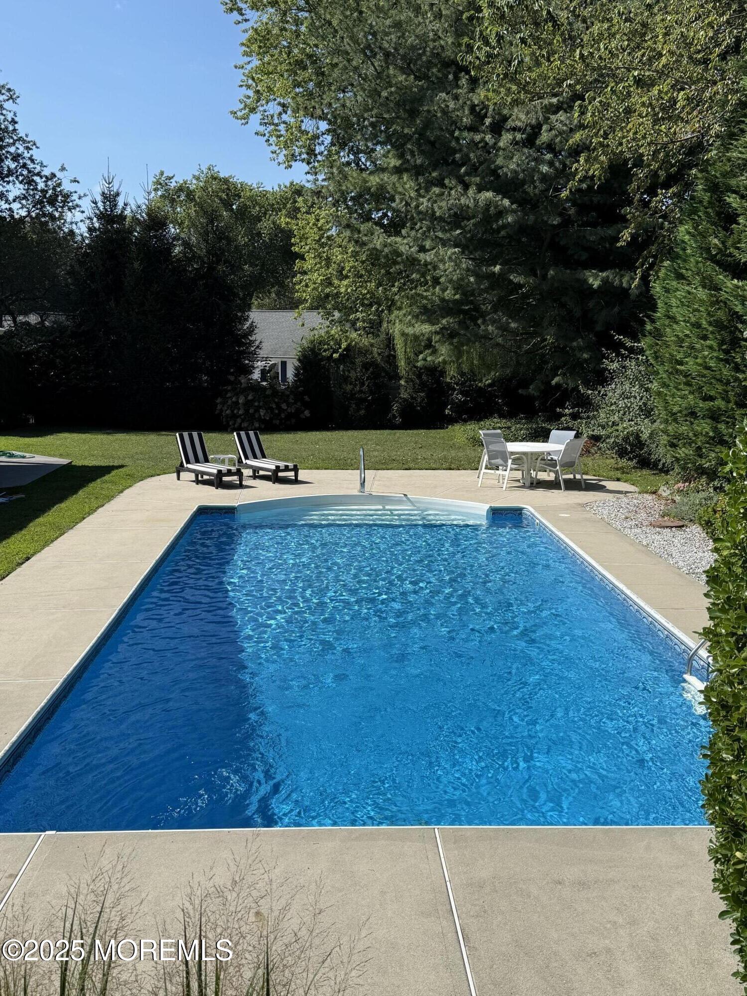 3412 Brandon Road Belmar, NJ 07719 - Photo 41 of 48 a view of a swimming pool with an outdoor space and seating area