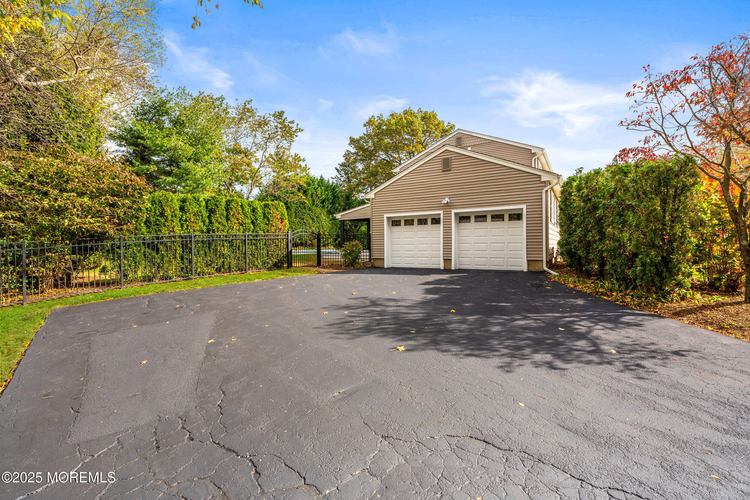3412 Brandon Road Belmar, NJ 07719 - Photo 44 of 48 a front view of a house with a yard and garage