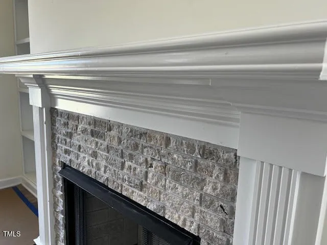 a view of room with window and a ceiling fan