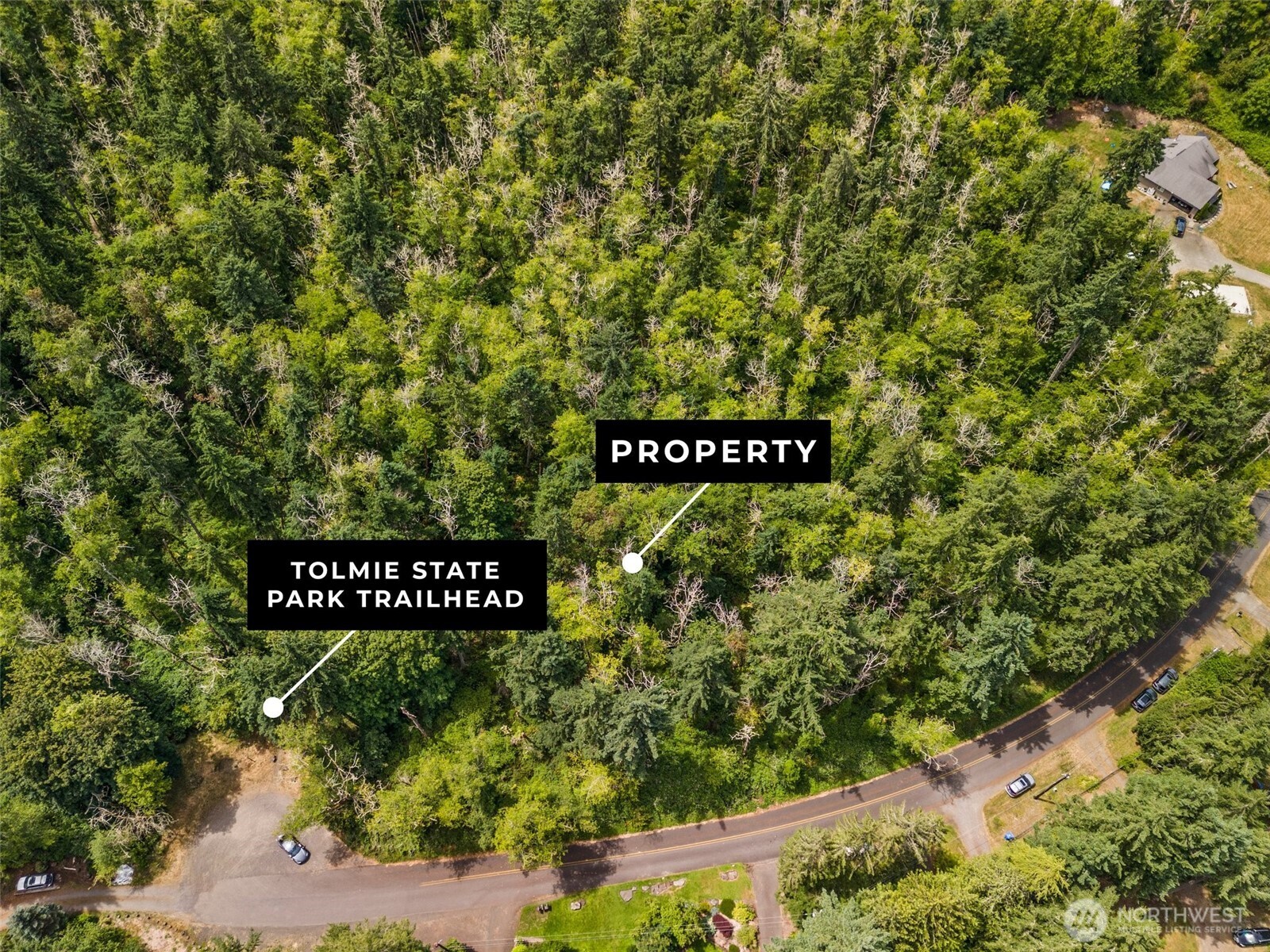 7605 Sandy Point Road Northeast Olympia, WA 98516 - Photo 13 of 25 a sign broad in front of the house