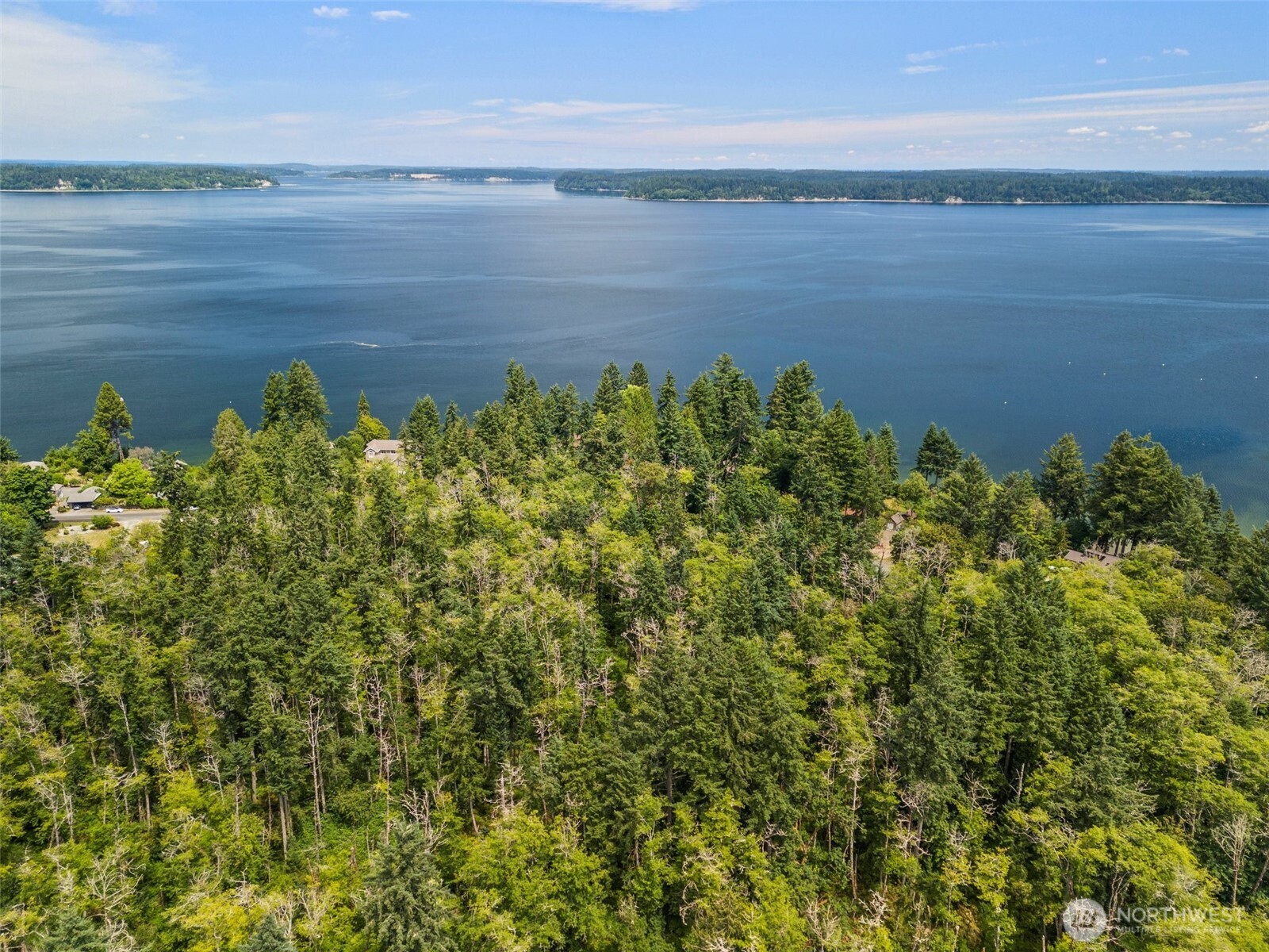 7605 Sandy Point Road Northeast Olympia, WA 98516 - Photo 17 of 25 a view of a lake with a lake