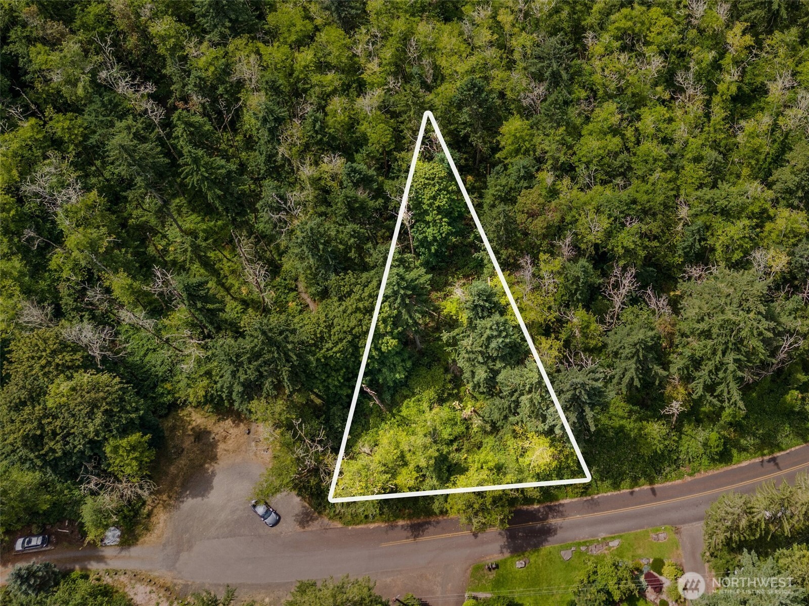 7605 Sandy Point Road Northeast Olympia, WA 98516 - Photo 8 of 25 a view of a yard with a small plants
