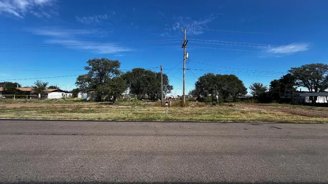 a view of a field with a sign board