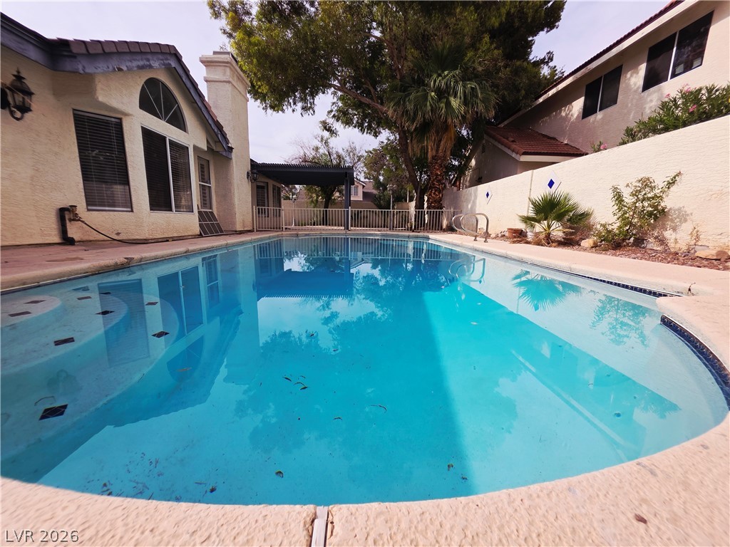 2920 Setting Sun Street Las Vegas, NV 89117 - Photo 40 of 43 This tranquil pool area offers a refreshing escape and a perfect spot for outdoor enjoyment.