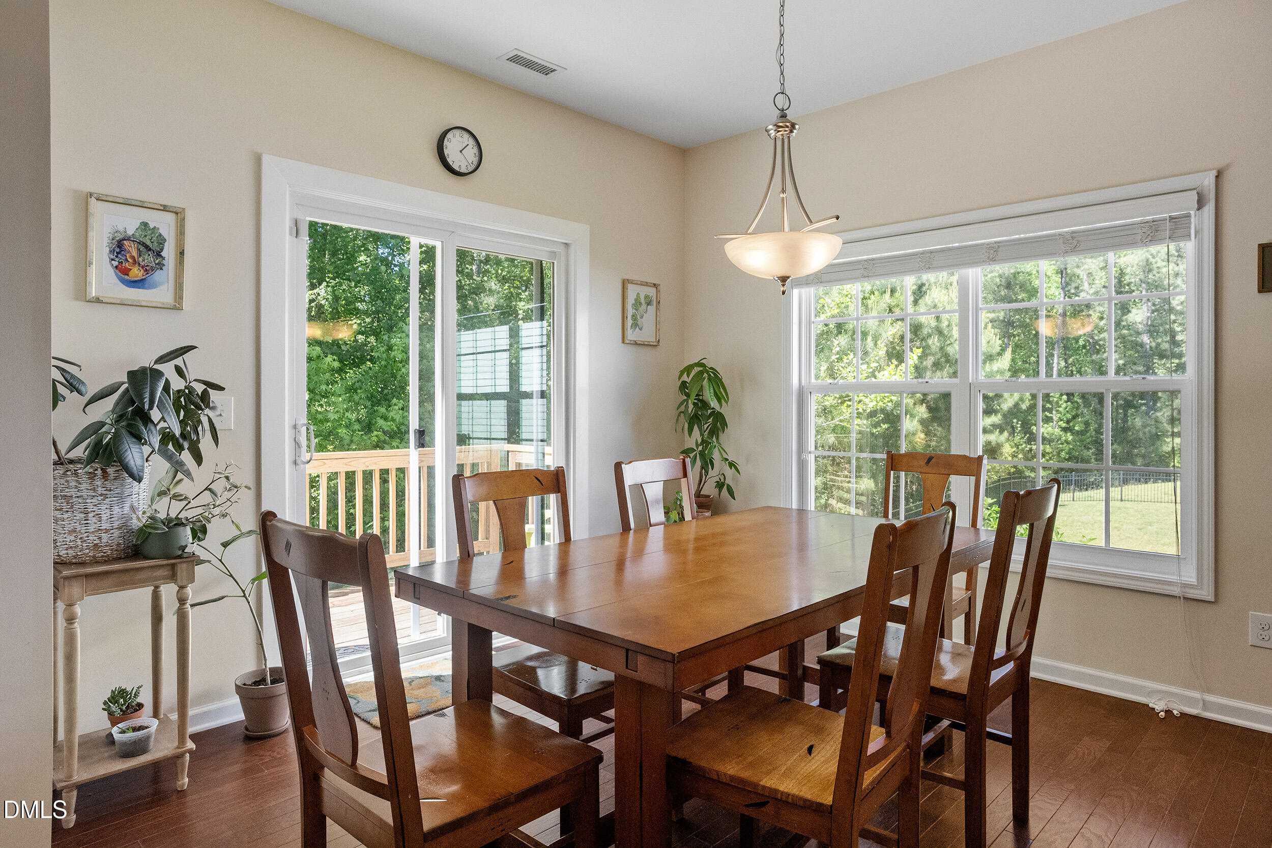 235 Strolling Way Durham, NC 27707 - Photo 15 of 32 a view of a dining room with furniture window and wooden floor