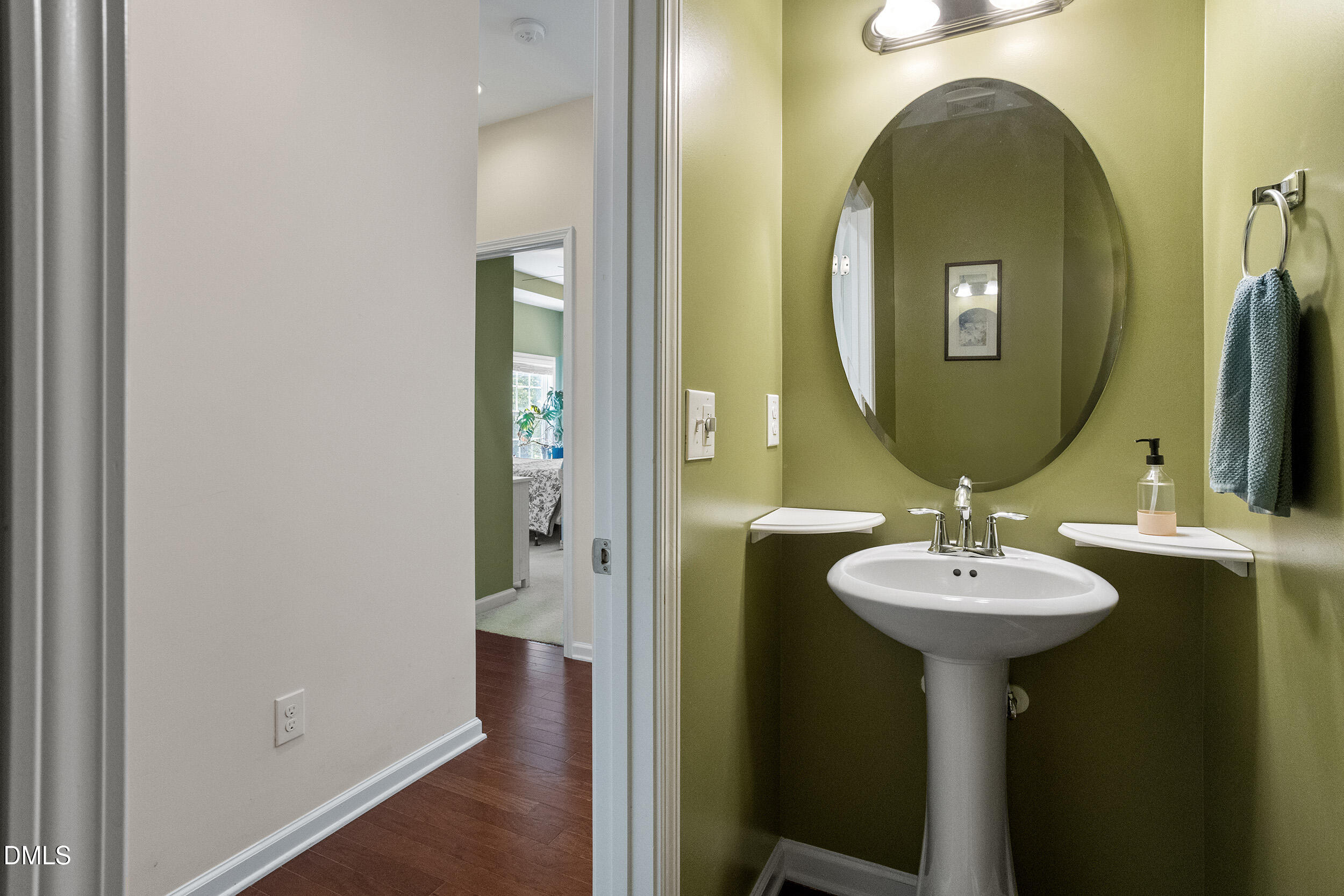 235 Strolling Way Durham, NC 27707 - Photo 18 of 32 a bathroom with a sink and a mirror