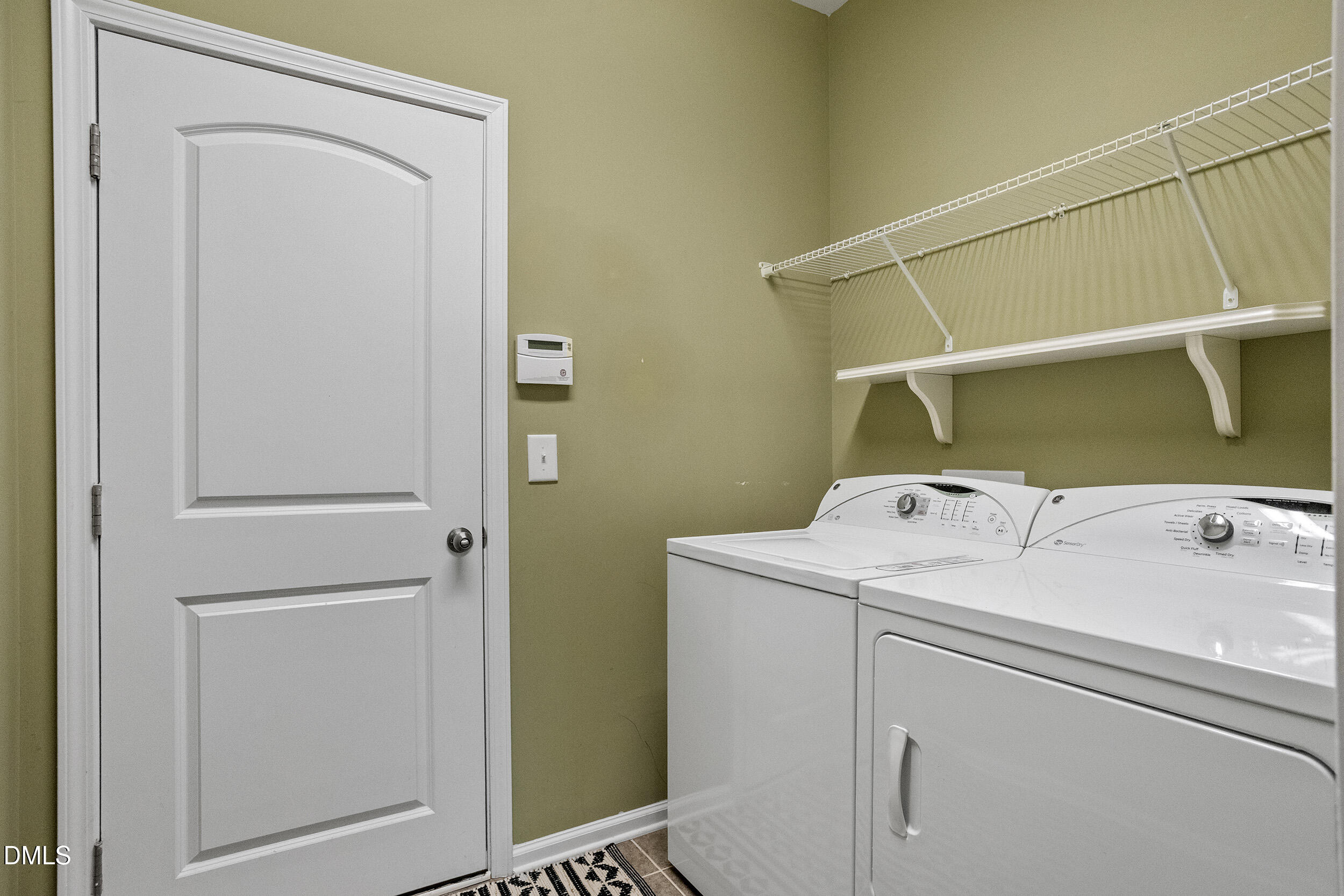 235 Strolling Way Durham, NC 27707 - Photo 19 of 32 a utility room with dryer and washer