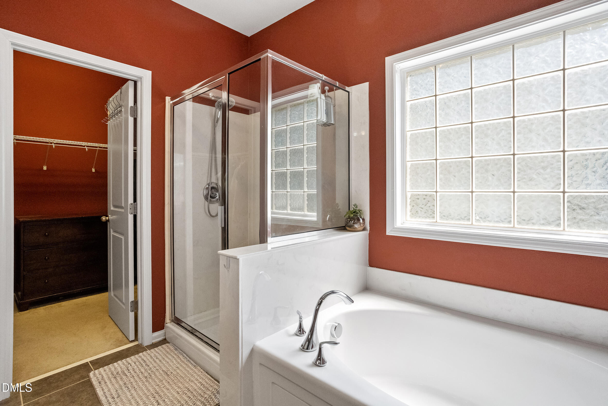 235 Strolling Way Durham, NC 27707 - Photo 23 of 32 a bathroom with a tub and a sink
