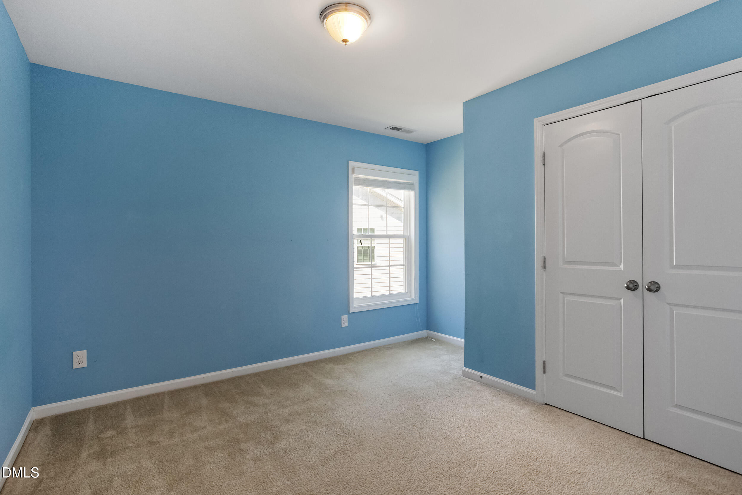 235 Strolling Way Durham, NC 27707 - Photo 24 of 32 a view of an empty room with window