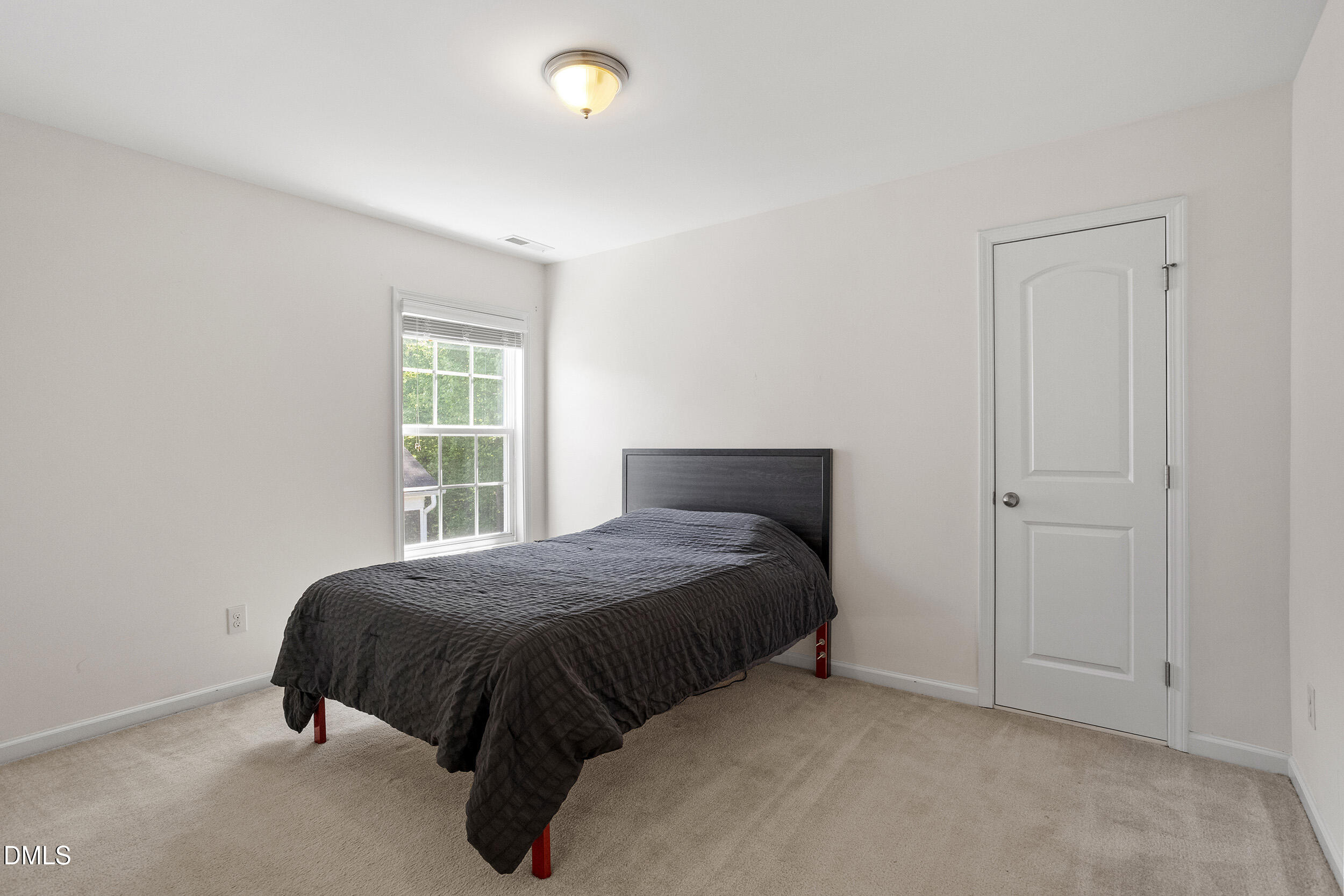 235 Strolling Way Durham, NC 27707 - Photo 25 of 32 a bedroom with a bed and window
