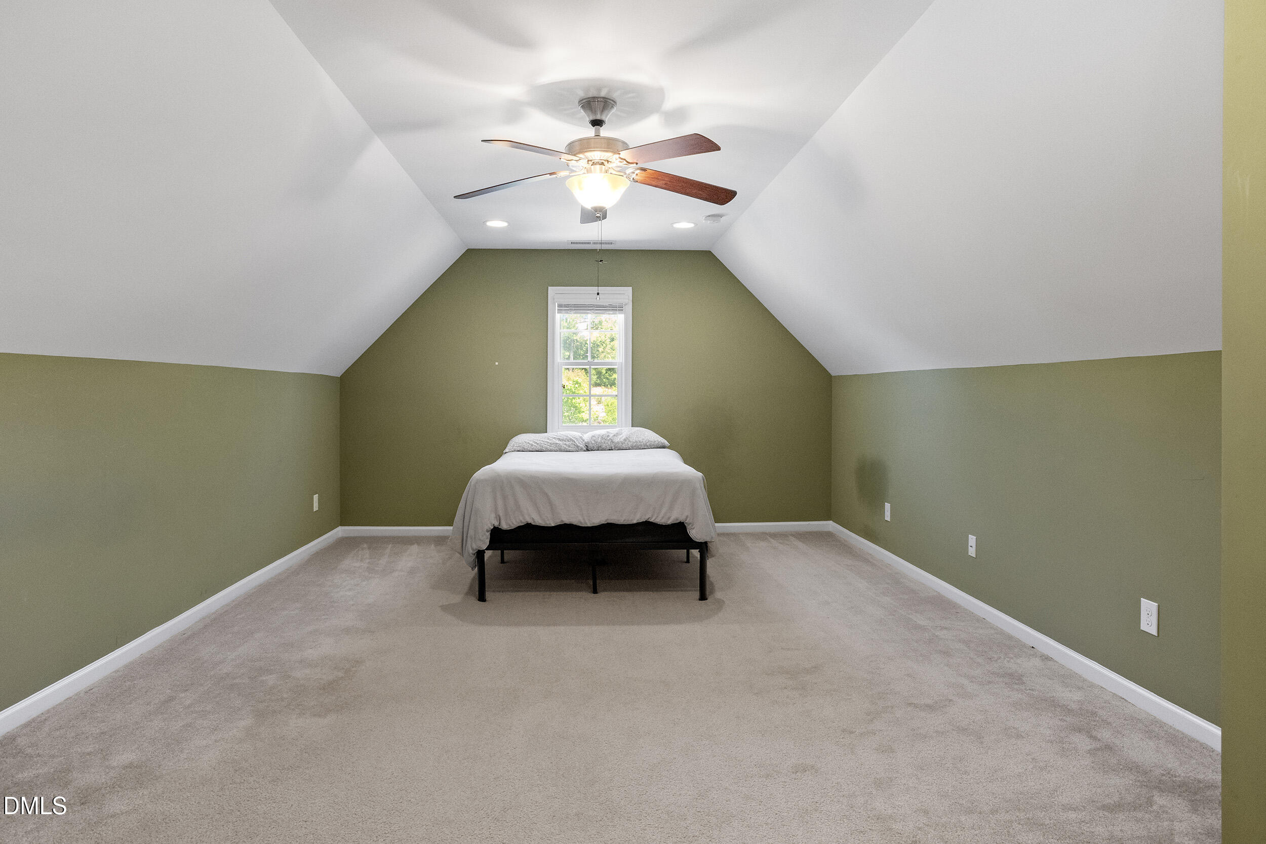 235 Strolling Way Durham, NC 27707 - Photo 27 of 32 a bedroom with a bed and a chandelier