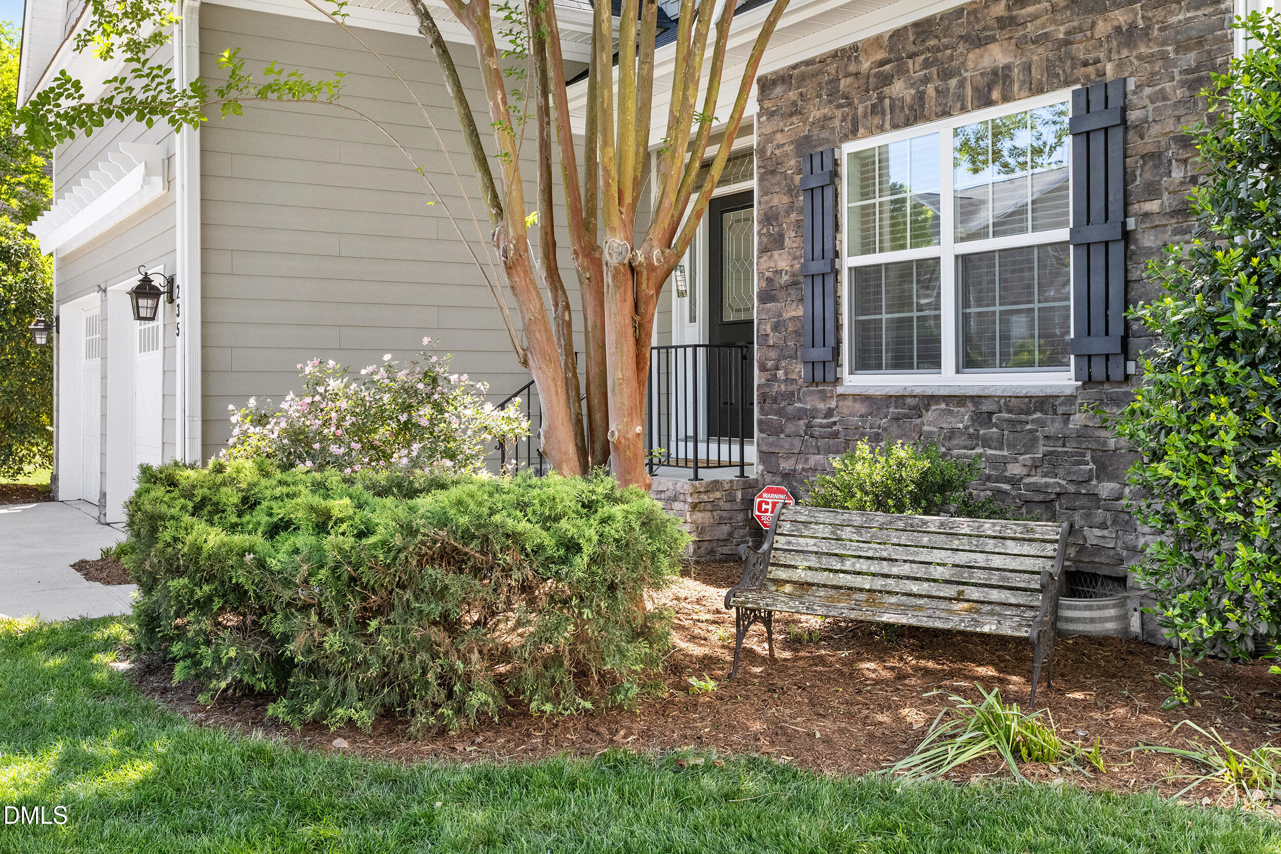 235 Strolling Way Durham, NC 27707 - Photo 3 of 32 a view of a house with a yard and sitting area