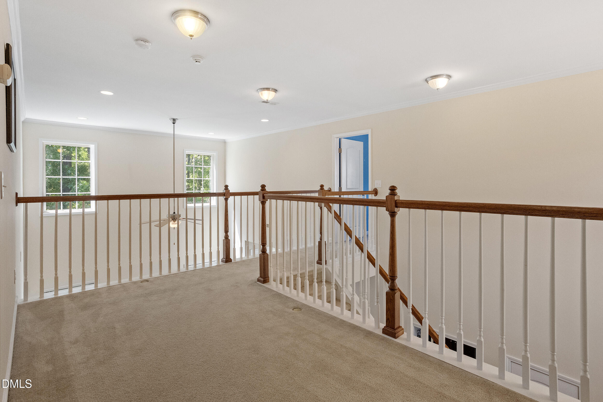 235 Strolling Way Durham, NC 27707 - Photo 32 of 32 a view of a hallway with wooden floor