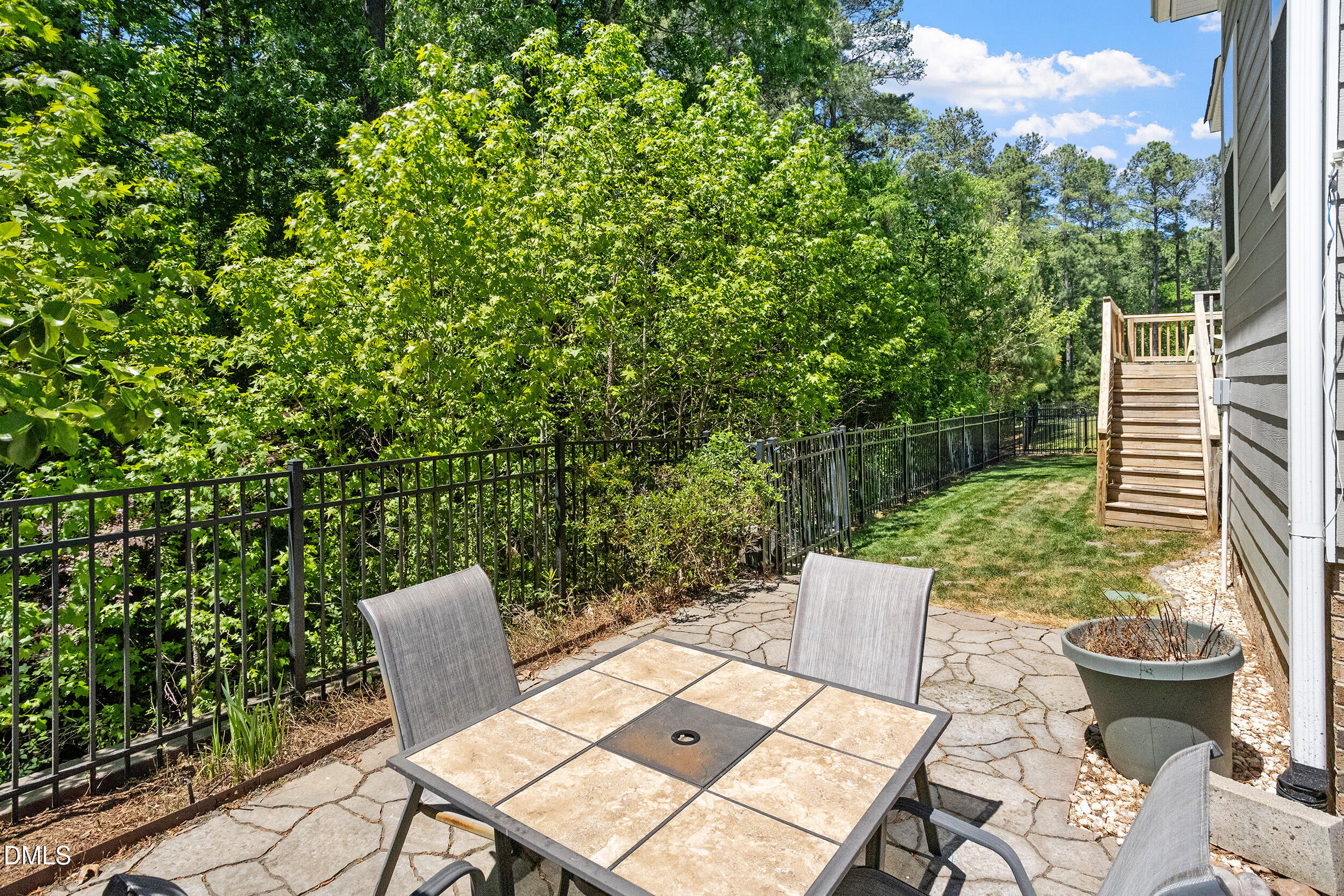235 Strolling Way Durham, NC 27707 - Photo 5 of 32 a view of a chairs and table in the patio