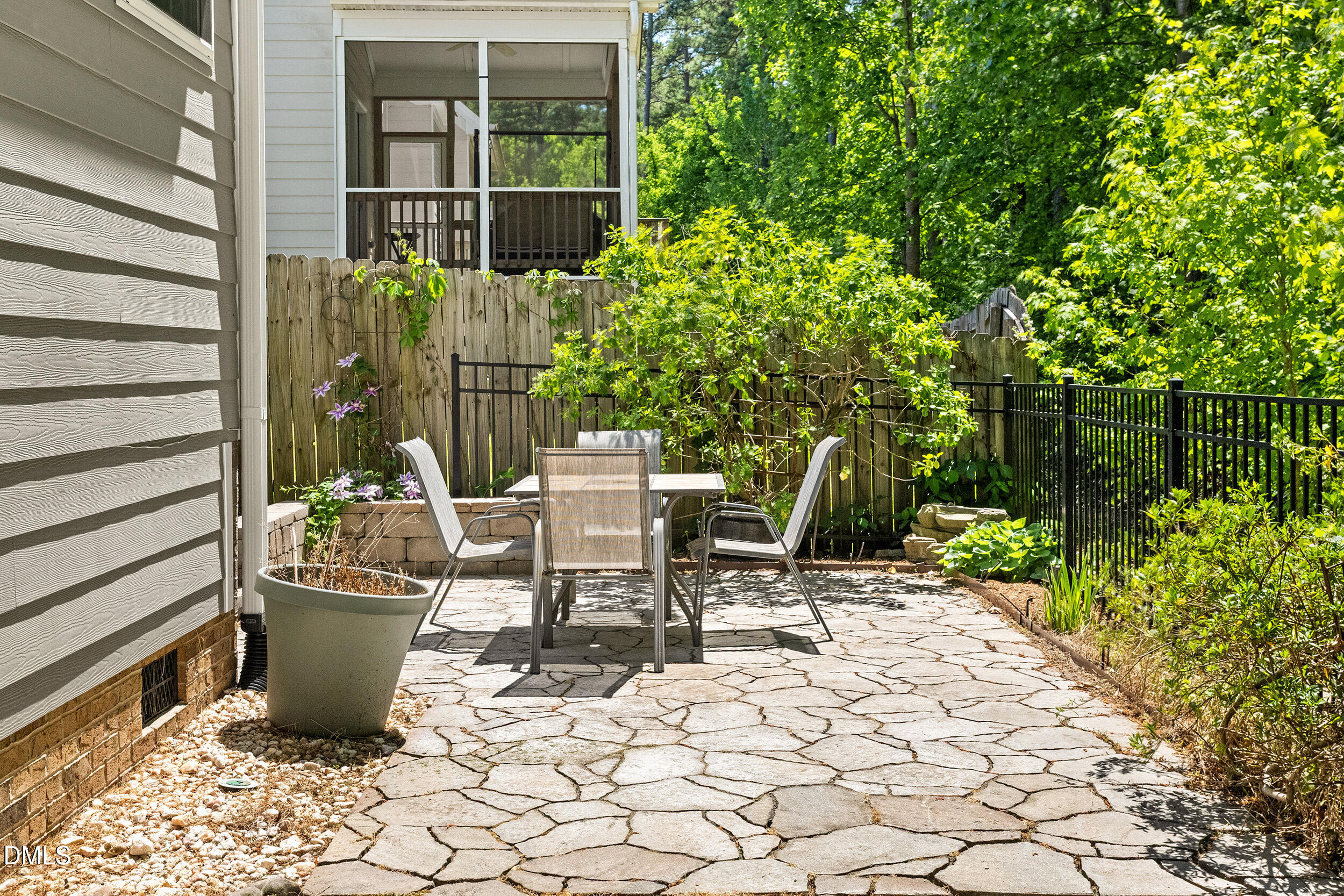 235 Strolling Way Durham, NC 27707 - Photo 7 of 32 a view of a chairs and table in the patio