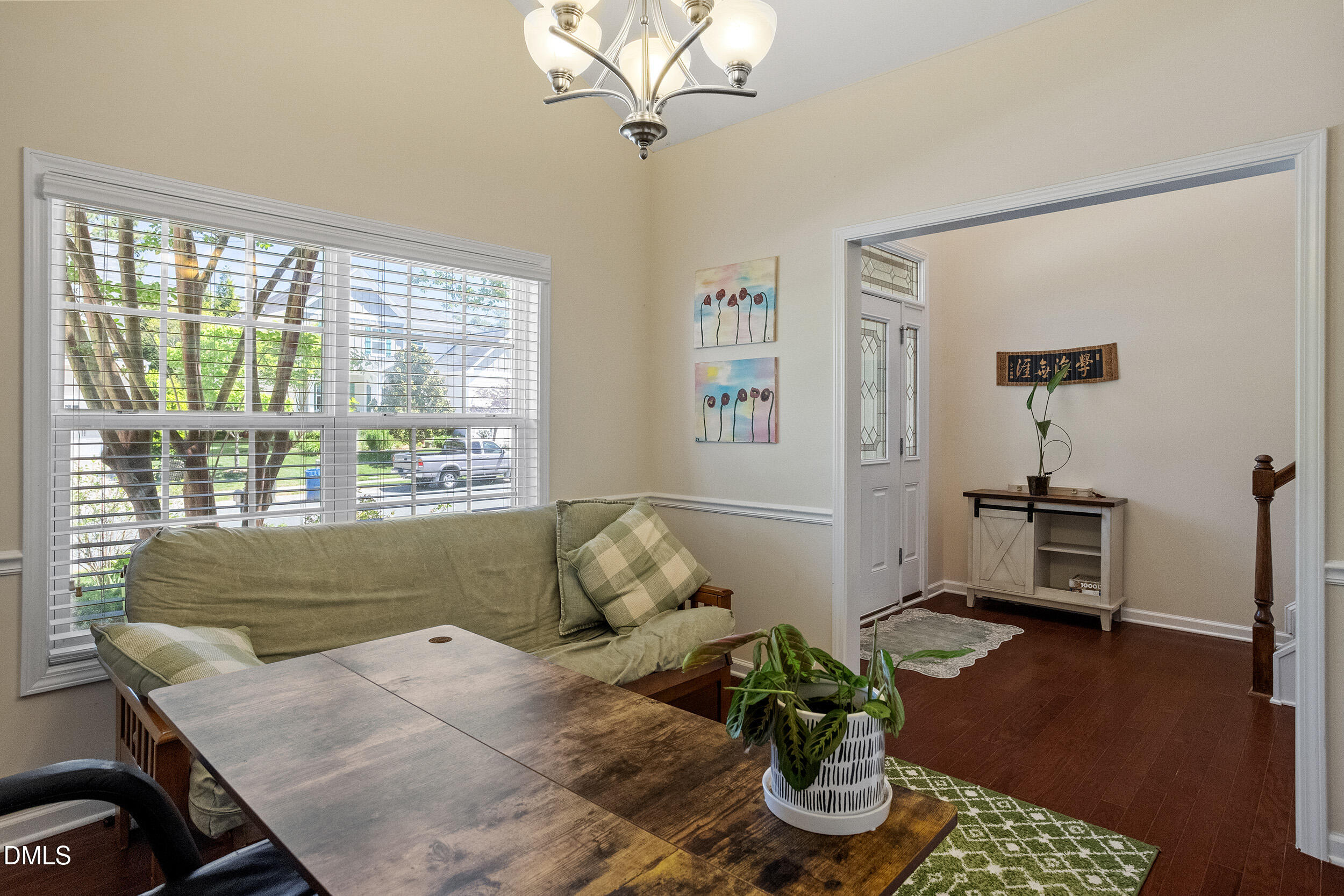 235 Strolling Way Durham, NC 27707 - Photo 10 of 32 a living room with furniture and a window