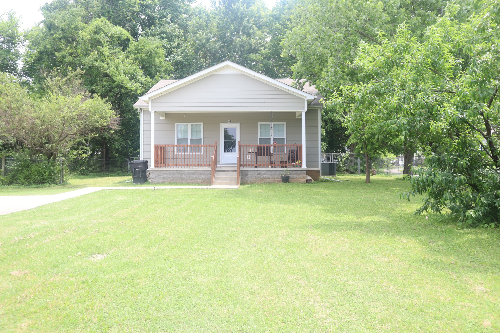 107 February Street Murfreesboro, TN 37129 - Photo 1 of 19 a front view of a house with a yard