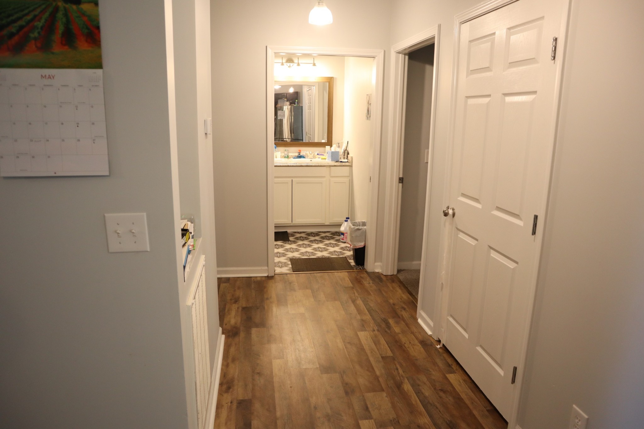 107 February Street Murfreesboro, TN 37129 - Photo 12 of 19 a view of a hallway with wooden floor and a bathroom