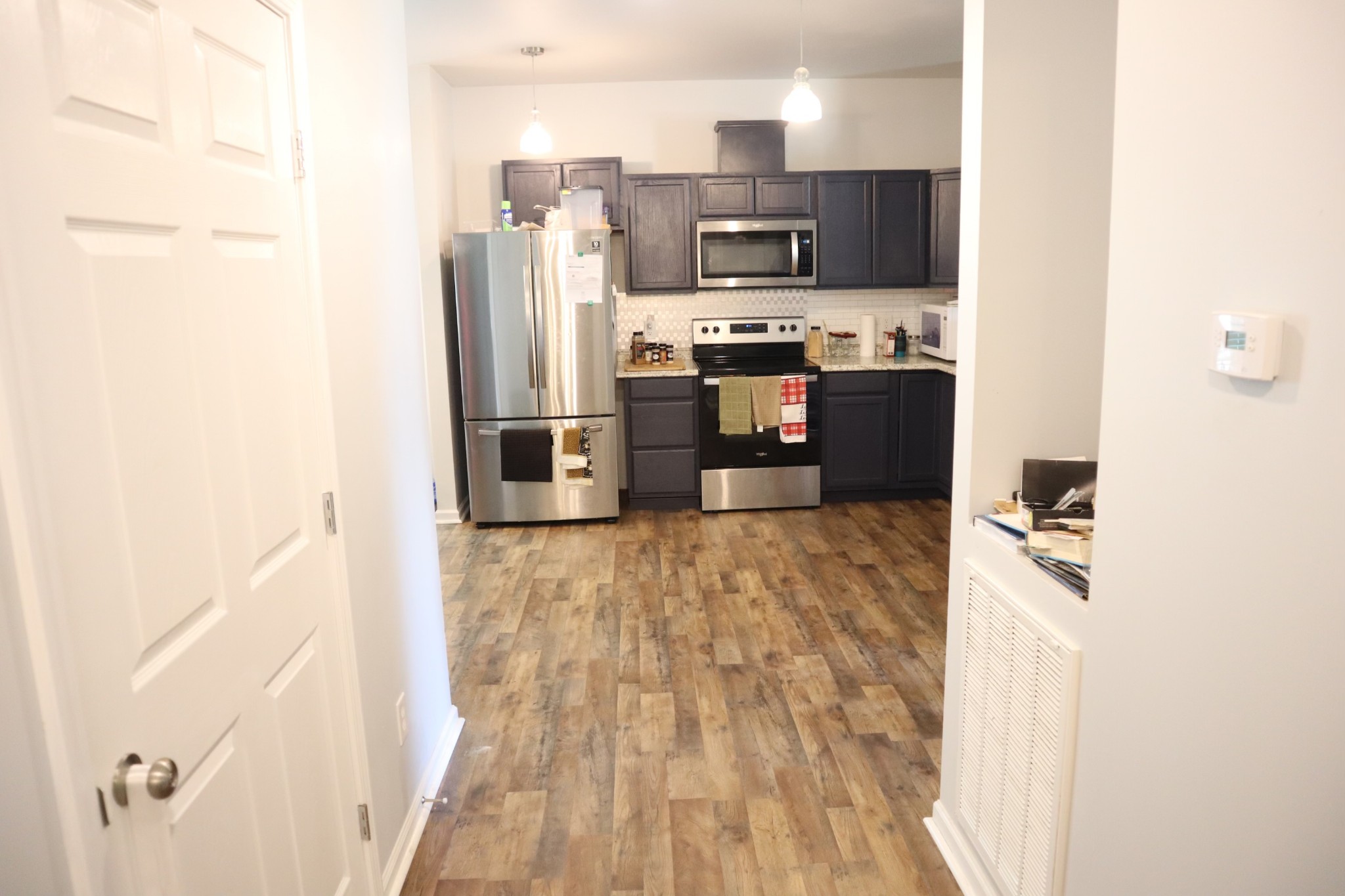 107 February Street Murfreesboro, TN 37129 - Photo 14 of 19 a kitchen with stainless steel appliances a refrigerator and a stove top oven