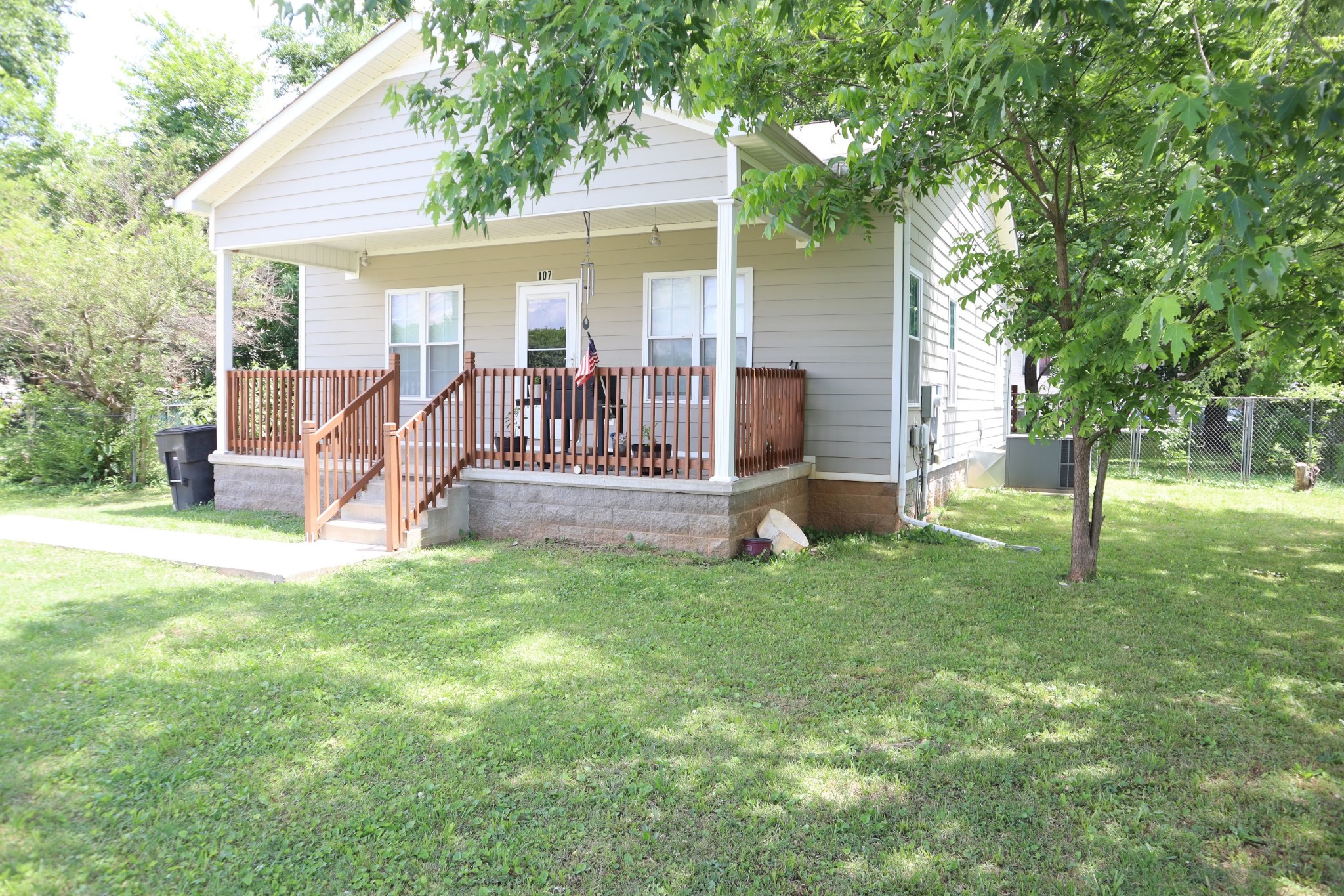 107 February Street Murfreesboro, TN 37129 - Photo 4 of 19 a view of a house with backyard and a tree