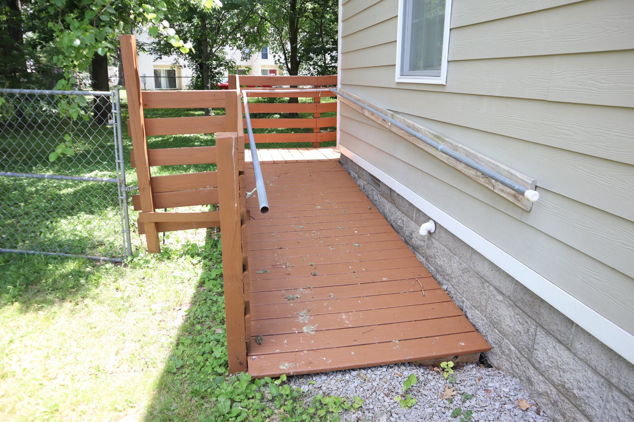 107 February Street Murfreesboro, TN 37129 - Photo 5 of 19 a backyard of a house with wooden floor and plants
