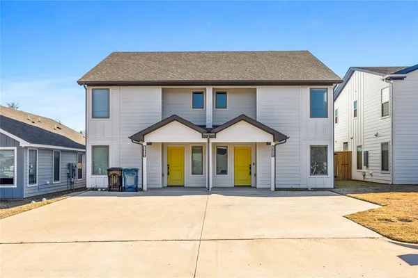 a front view of a house with a garage