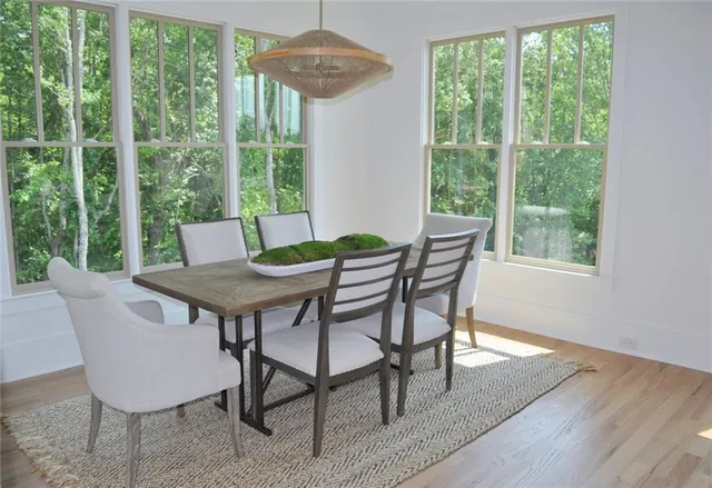 a view of a dining room with furniture window and outside view