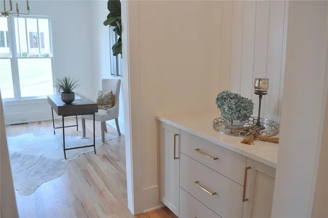 a view of living room and wooden floor